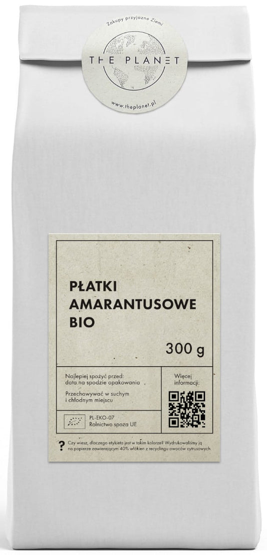 Bio Amarantflocken von THE PLANET, 300 g, in einer transparenten Verpackung, mit getrockneten Amarantkörnern sichtbar.