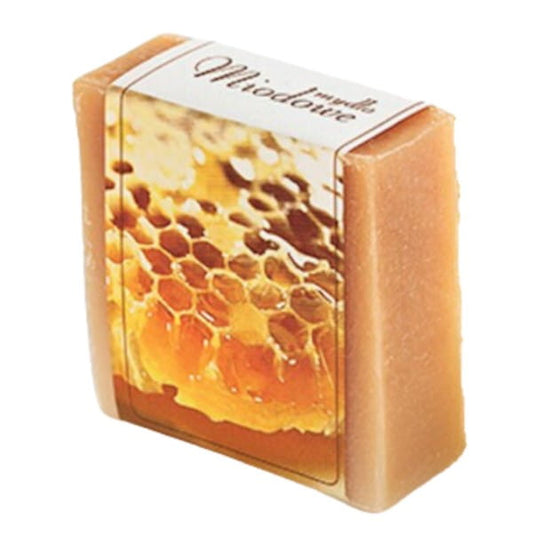 Naturseife von KORANA mit Honig, 100 g, zeigt die Seifenform und natürliche Textur, ideal für sanfte Hautpflege.