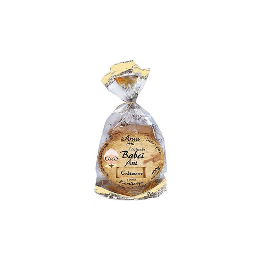 Dinkel-Vanille-Kekse von ANIA in 100 g Packung, frisch gebacken und mit Vanillegeschmack, auf einem weißen Teller präsentiert