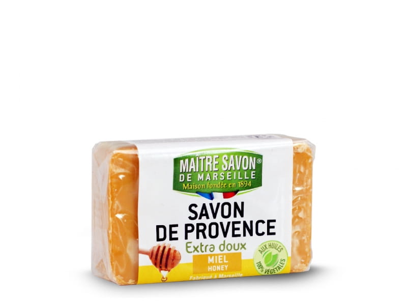 Provenzalische Honigseife von Maitre Savon, 100g, mit natürlichem Honigduft und cremiger Textur, sichtbar in der Verpackung.